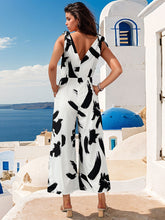 Load image into Gallery viewer, Tied Printed Surplice Sleeveless Jumpsuit
